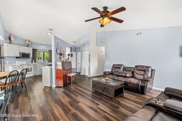 1298 Corning Ave NW, Palm Bay, FL 32907 - living room with ceiling fan, dark wood-style flooring, and high vaulted ceiling