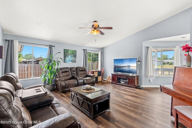 1298 Corning Ave NW, Palm Bay, FL 32907 - living room featuring ceiling fan, wood finished floors, healthy amount of natural light, and vaulted ceiling