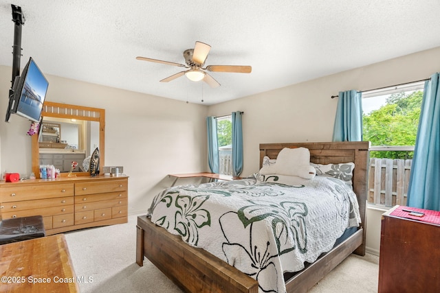 1298 Corning Ave NW, Palm Bay, FL 32907 - bedroom featuring carpet floors, ceiling fan, and a textured ceiling