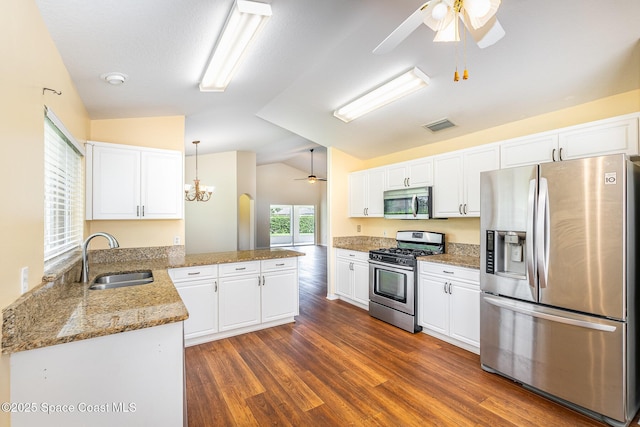 1713 Keys Gate Dr, Melbourne, FL 32940 - kitchen with appliances with stainless steel finishes, ceiling fan, lofted ceiling, a peninsula, and white cabinetry