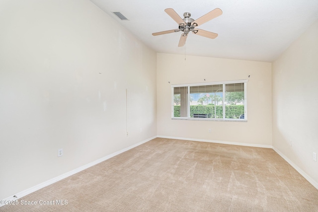 1713 Keys Gate Dr, Melbourne, FL 32940 - empty room featuring light colored carpet, vaulted ceiling, and a ceiling fan