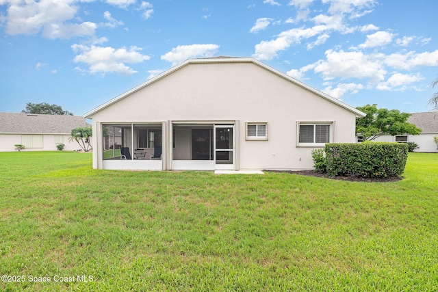 1713 Keys Gate Dr, Melbourne, FL 32940 - back of property with a sunroom, a lawn, and stucco siding