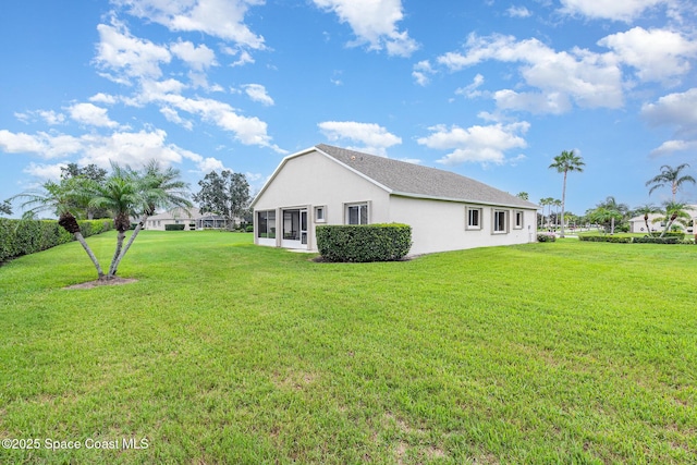 1713 Keys Gate Dr, Melbourne, FL 32940 - view of side of property with a yard and stucco siding
