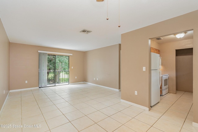 2234 Flower Tree Cir, Melbourne, FL 32935 - empty room featuring light tile patterned floors and baseboards