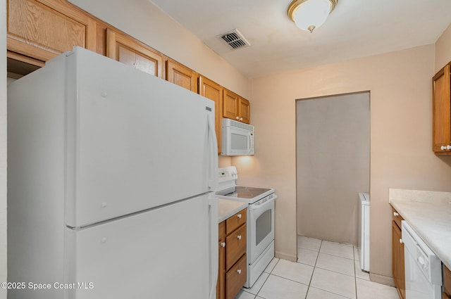 2234 Flower Tree Cir, Melbourne, FL 32935 - kitchen featuring white appliances, light tile patterned flooring, brown cabinets, and light countertops