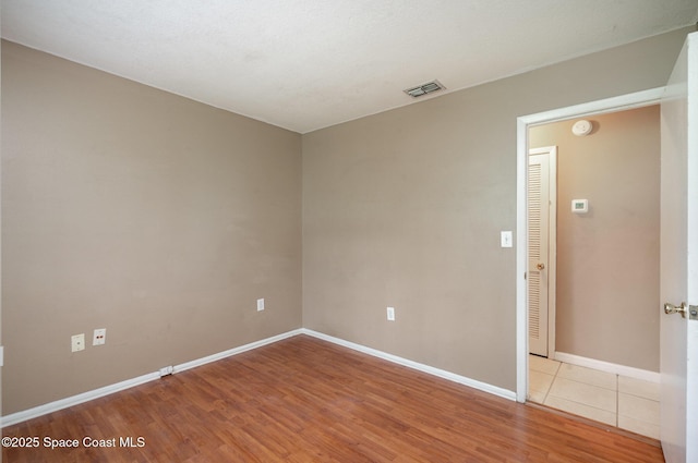 2234 Flower Tree Cir, Melbourne, FL 32935 - empty room featuring light wood finished floors and a smoke detector