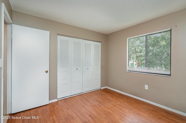 2234 Flower Tree Cir, Melbourne, FL 32935 - unfurnished bedroom with light wood-type flooring and a closet