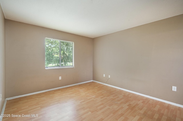 2234 Flower Tree Cir, Melbourne, FL 32935 - spare room featuring light wood-type flooring and baseboards