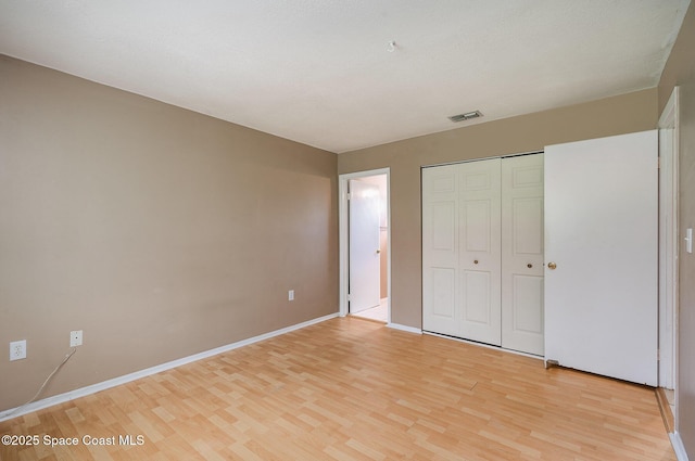 2234 Flower Tree Cir, Melbourne, FL 32935 - unfurnished bedroom with light wood finished floors and a closet