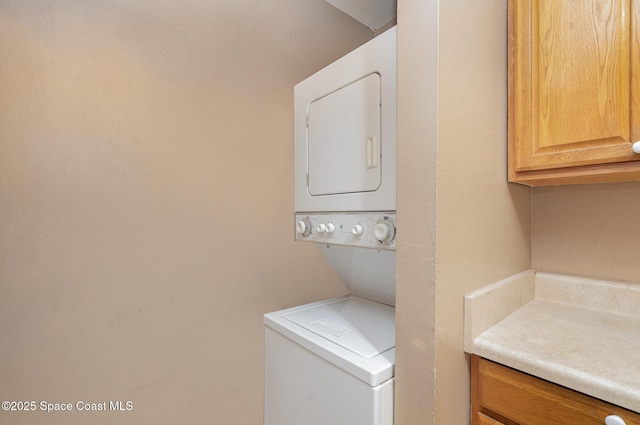 2234 Flower Tree Cir, Melbourne, FL 32935 - laundry area featuring stacked washer and clothes dryer