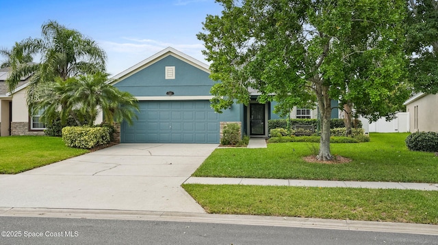 1448 Attilburgh Blvd, West Melbourne, FL 32904 - view of front of property featuring a garage, driveway, and stucco siding