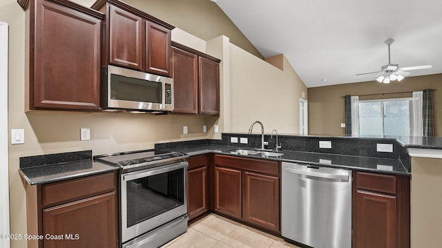 1448 Attilburgh Blvd, West Melbourne, FL 32904 - kitchen with appliances with stainless steel finishes, vaulted ceiling, ceiling fan, a peninsula, and dark stone counters