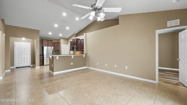 1448 Attilburgh Blvd, West Melbourne, FL 32904 - kitchen featuring stainless steel appliances, ceiling fan, a peninsula, light tile patterned floors, and high vaulted ceiling