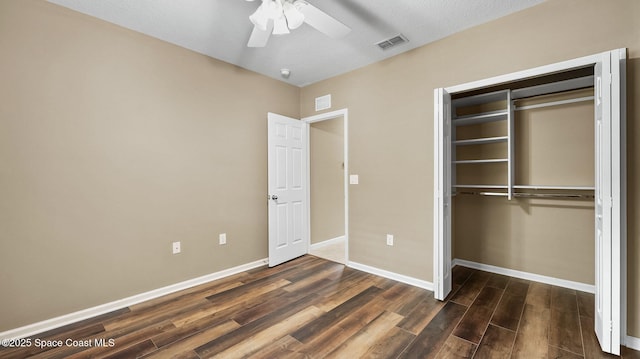 1448 Attilburgh Blvd, West Melbourne, FL 32904 - unfurnished bedroom with dark wood-style flooring, a closet, and a ceiling fan