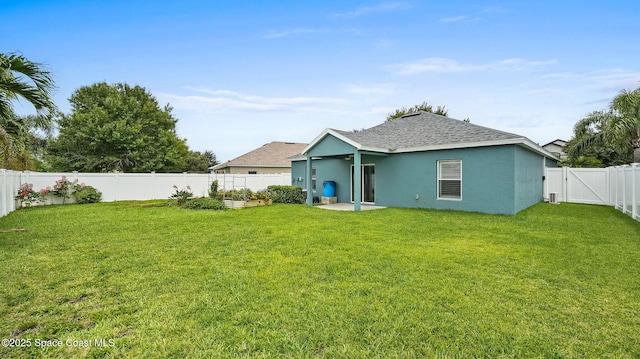 1448 Attilburgh Blvd, West Melbourne, FL 32904 - back of house featuring a fenced backyard, roof with shingles, stucco siding, and a vegetable garden