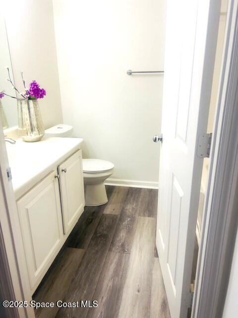 1070 Bella Vista Blvd Unit 110, Saint Augustine, FL 32084 - half bathroom featuring vanity and wood finished floors