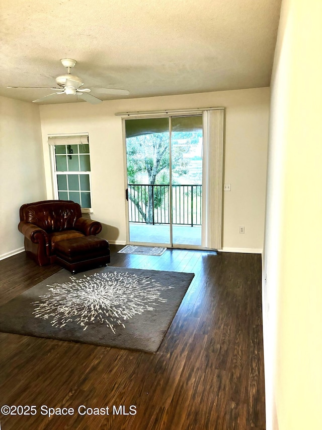 1070 Bella Vista Blvd Unit 110, Saint Augustine, FL 32084 - living room with wood finished floors, a ceiling fan, and a textured ceiling