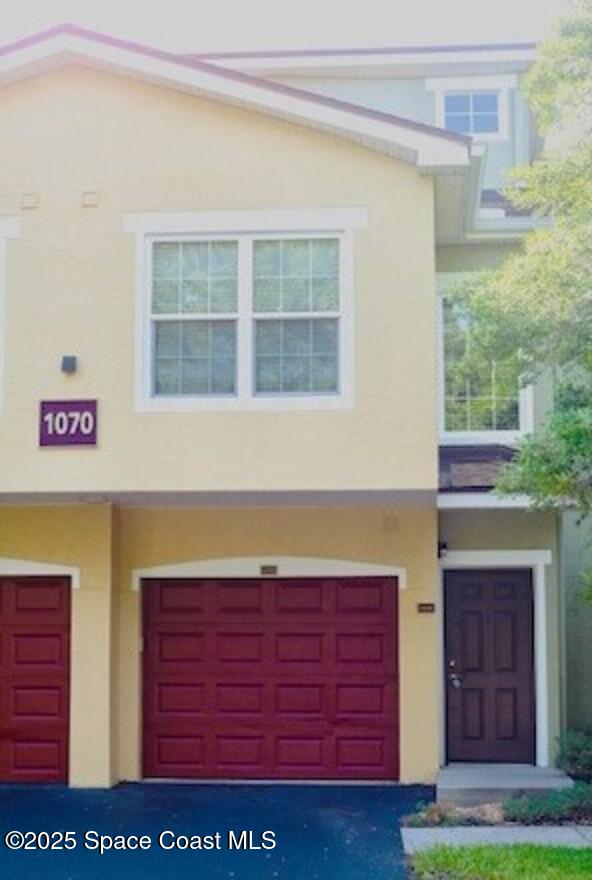 1070 Bella Vista Blvd Unit 110, Saint Augustine, FL 32084 - townhome / multi-family property featuring an attached garage and stucco siding