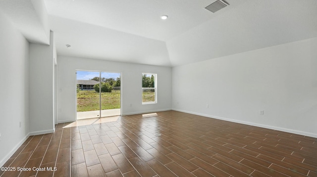 298 Trilby Rd SW, Palm Bay, FL 32908 - empty room with dark wood-type flooring, vaulted ceiling, and recessed lighting