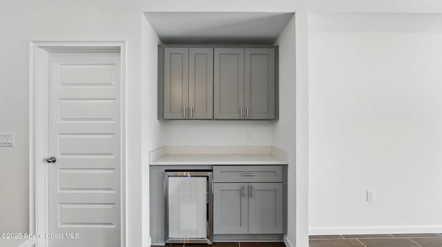 298 Wendover Rd SW, Palm Bay, FL 32908 - indoor dry bar with wine cooler and dark tile patterned flooring
