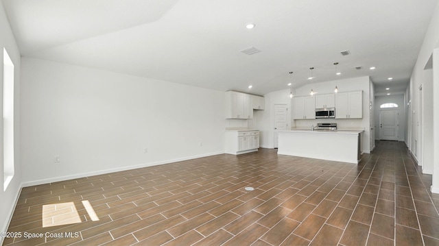 298 Wendover Rd SW, Palm Bay, FL 32908 - unfurnished living room featuring vaulted ceiling, recessed lighting, and dark wood-type flooring