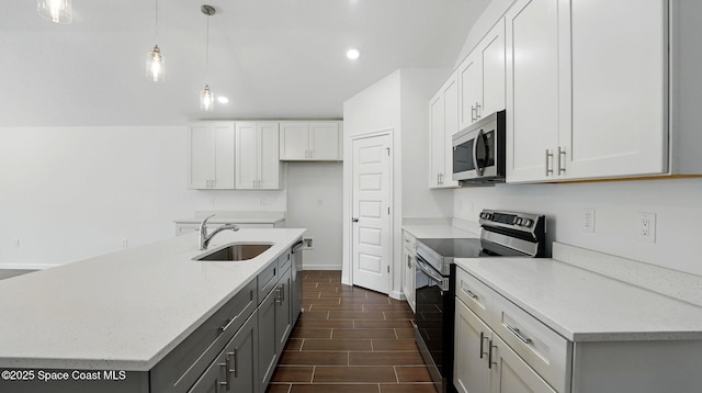 298 Wendover Rd SW, Palm Bay, FL 32908 - kitchen with stainless steel appliances, a kitchen island with sink, recessed lighting, light stone countertops, and hanging light fixtures
