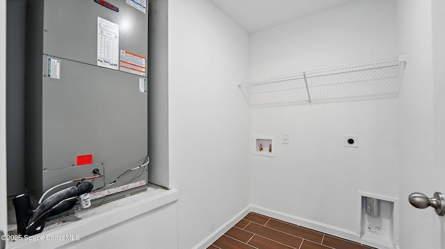 298 Wendover Rd SW, Palm Bay, FL 32908 - laundry area featuring electric dryer hookup, heating unit, washer hookup, and wood tiled floors
