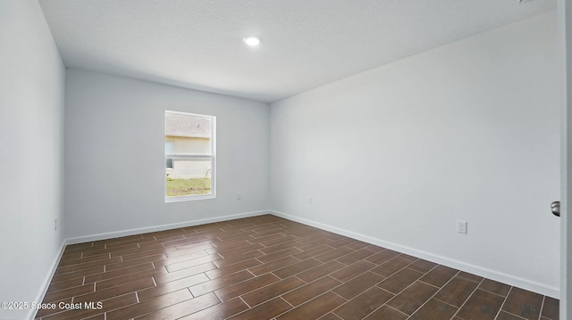 298 Wendover Rd SW, Palm Bay, FL 32908 - empty room featuring wood tiled floors and recessed lighting
