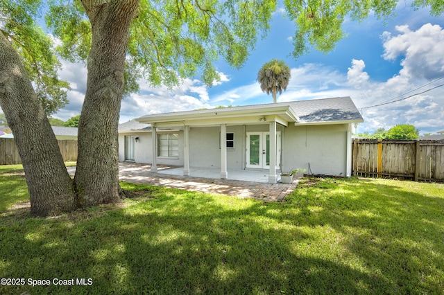 1249 Coosa Ave NE, Palm Bay, FL 32907 - rear view of property with a patio, a fenced backyard, and stucco siding
