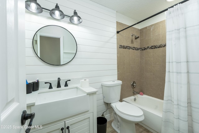 1249 Coosa Ave NE, Palm Bay, FL 32907 - full bathroom with vanity, shower / bath combo, and a textured ceiling