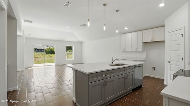 1343 Danforth St SW, Palm Bay, FL 32908 - kitchen with dishwasher, wood tiled floors, white cabinetry, open floor plan, and recessed lighting