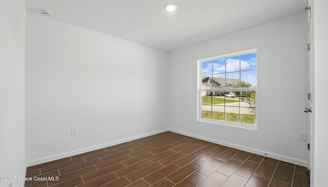 1343 Danforth St SW, Palm Bay, FL 32908 - empty room with a smoke detector, wood finish floors, and recessed lighting