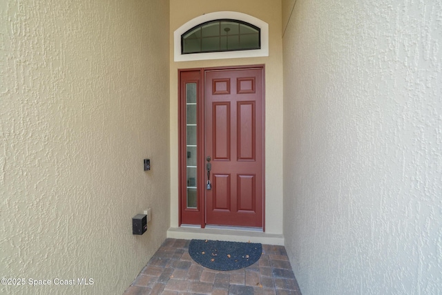 1026 Shiloh Dr, Melbourne, FL 32940 - doorway to property with stucco siding