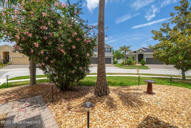 1026 Shiloh Dr, Melbourne, FL 32940 - view of front of house with driveway and a front lawn