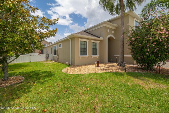 1026 Shiloh Dr, Melbourne, FL 32940 - back of house with stucco siding
