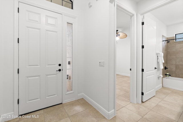 1026 Shiloh Dr, Melbourne, FL 32940 - foyer entrance featuring light tile patterned floors and baseboards