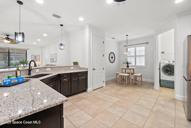 1026 Shiloh Dr, Melbourne, FL 32940 - kitchen featuring washer / clothes dryer, ornamental molding, light tile patterned flooring, recessed lighting, and a ceiling fan