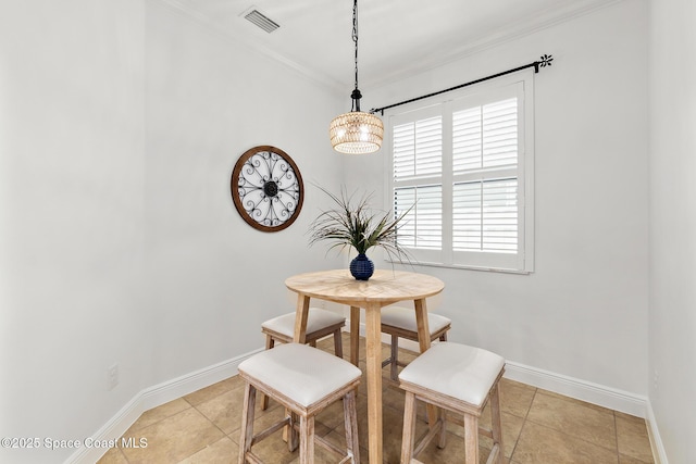 1026 Shiloh Dr, Melbourne, FL 32940 - dining space with crown molding, light tile patterned floors, and a chandelier