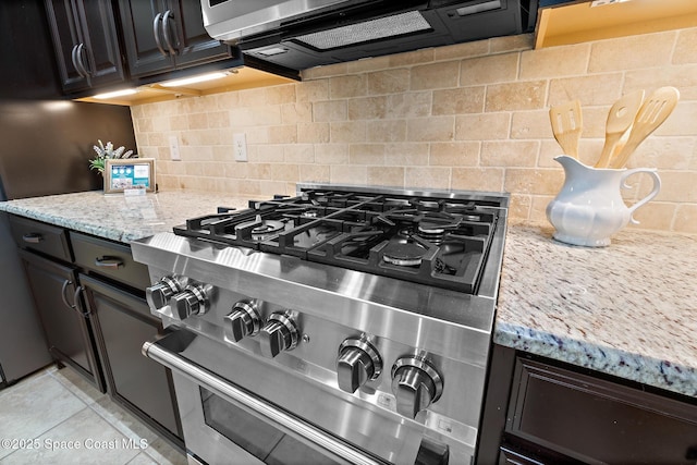 1026 Shiloh Dr, Melbourne, FL 32940 - kitchen with appliances with stainless steel finishes, backsplash, and light stone countertops