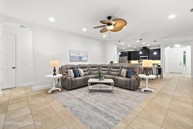 1026 Shiloh Dr, Melbourne, FL 32940 - living room featuring light tile patterned floors, a ceiling fan, arched walkways, and recessed lighting