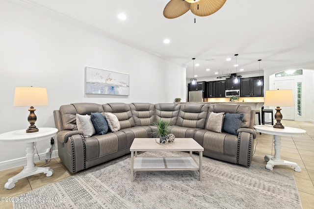 1026 Shiloh Dr, Melbourne, FL 32940 - living area featuring light tile patterned floors, recessed lighting, ceiling fan, and crown molding