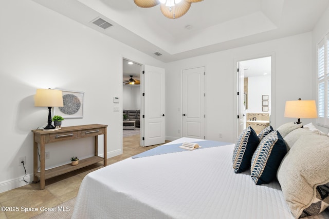 1026 Shiloh Dr, Melbourne, FL 32940 - bedroom with light tile patterned floors, a raised ceiling, and a ceiling fan