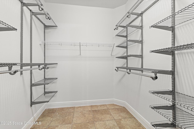 1026 Shiloh Dr, Melbourne, FL 32940 - walk in closet with stone finish flooring