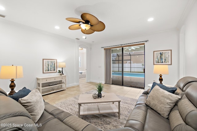 1026 Shiloh Dr, Melbourne, FL 32940 - living room with ceiling fan, light tile patterned floors, arched walkways, crown molding, and recessed lighting