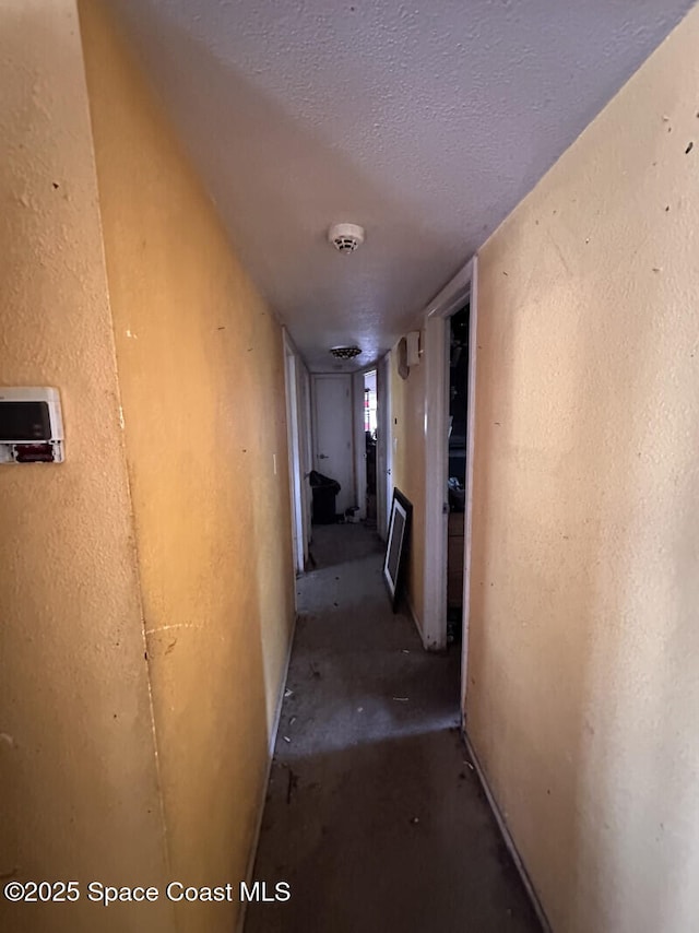 2793 N Breeze Rd, Melbourne, FL 32935 - hall featuring a textured ceiling