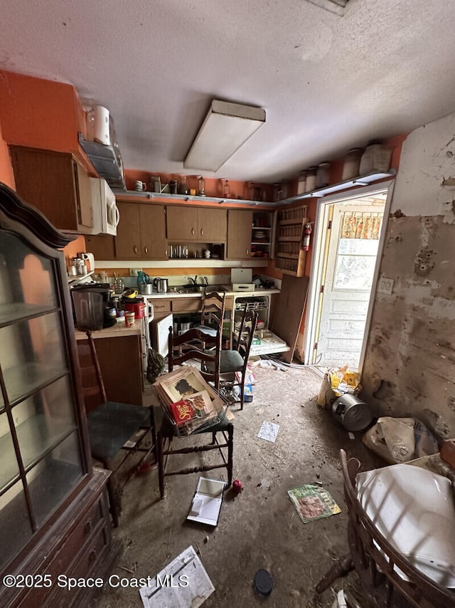 2793 N Breeze Rd, Melbourne, FL 32935 - kitchen featuring a textured ceiling and open shelves