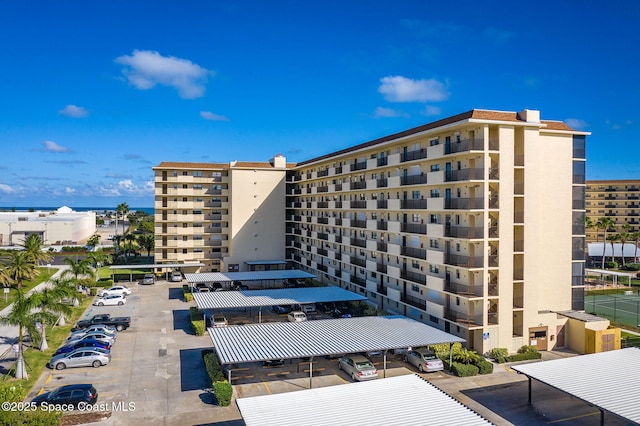 520 Palm Springs Blvd Unit 405, Indian Harbour Beach, FL 32937 - view of apartment building / complex featuring uncovered parking