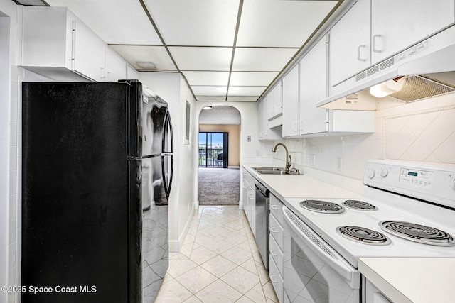 520 Palm Springs Blvd Unit 405, Indian Harbour Beach, FL 32937 - kitchen with electric stove, freestanding refrigerator, arched walkways, under cabinet range hood, and light countertops