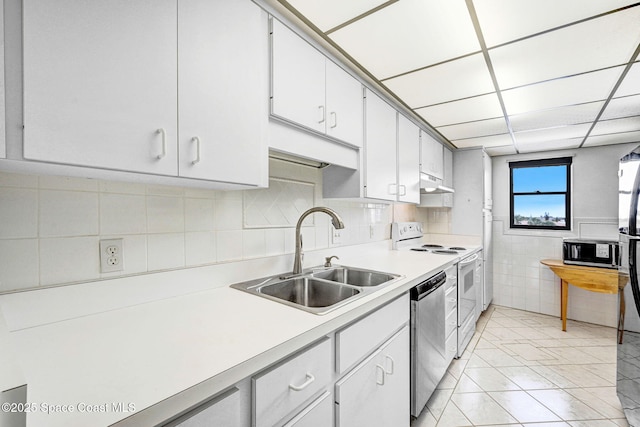 520 Palm Springs Blvd Unit 405, Indian Harbour Beach, FL 32937 - kitchen with white range with electric cooktop, stainless steel dishwasher, light countertops, under cabinet range hood, and white cabinets