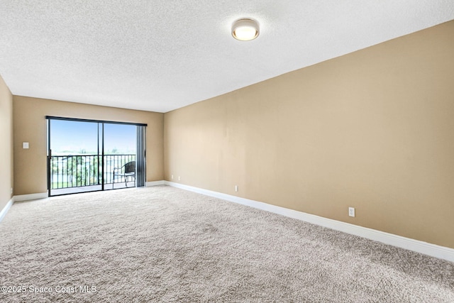 520 Palm Springs Blvd Unit 405, Indian Harbour Beach, FL 32937 - empty room with carpet flooring and a textured ceiling